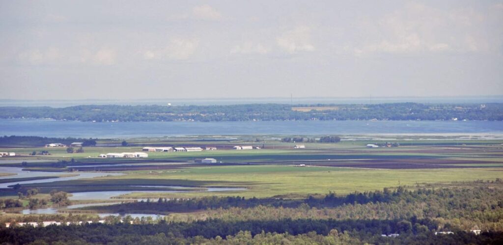 Arial photo of the Holland Marsh, with Lake Simcoe in the distance. Credit Jeff Laidlaw.