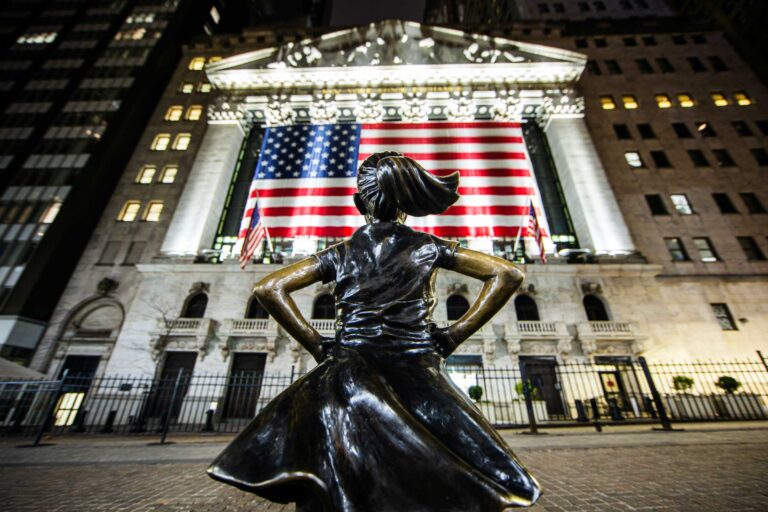 Photo of the Fearless Girl statue on Wall Street, with the NYSE in front of her. Photo by Ahmer Kalam