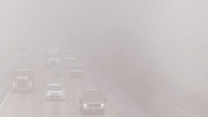 Photo of a highway with vehicles barely visible through heavy smog. Credit Ivan Bogdanov, Unsplash.